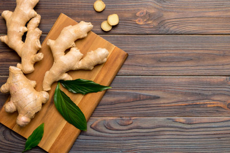 ginger on cutting board table, top view. Space for text.