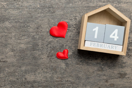 Valentine Day theme with wooden block calendar. Greeting card template for Valentines Day. Top view, copy space for text.の写真素材