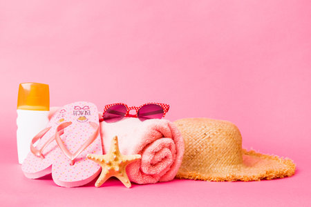 Top view composition of flip flops placed with beach accessories perspective view on table background. Tropical summer vacation concept Flat lay.の写真素材