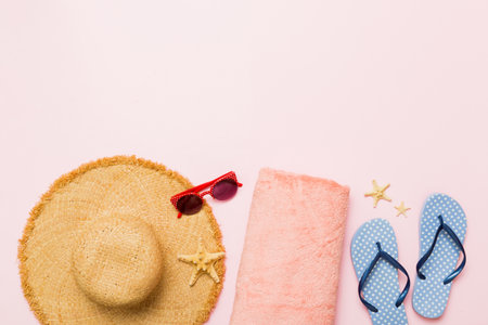 Top view travel or vacation concept. Composition with stylish beach accessories on colored...