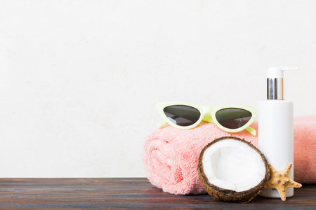 Top view composition of flip flops placed with beach accessories perspective view on table background. Tropical summer vacation concept Flat lay.の写真素材