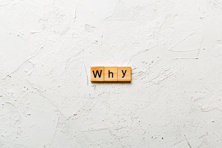 WHY word written on wood block. WHY text on cement table for your design, concept.の写真素材
