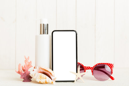 Smartphone mock up template with summer objects. Perspective view with copy space for text.の写真素材