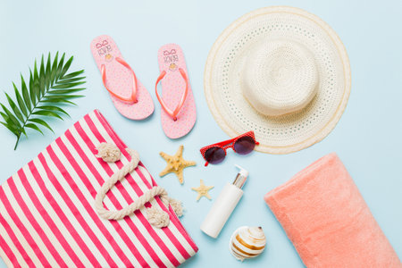 Composition with stylish beach accessories on colored background, top view. Beach fashion flat lay,...
