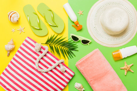 Composition with stylish beach accessories on colored background, top view. Beach fashion flat lay,...