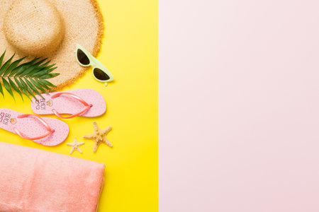 Top view travel or vacation concept. Composition with stylish beach accessories on colored background, top view. Beach fashion flat lay, summer concept. Trendy colors.の写真素材