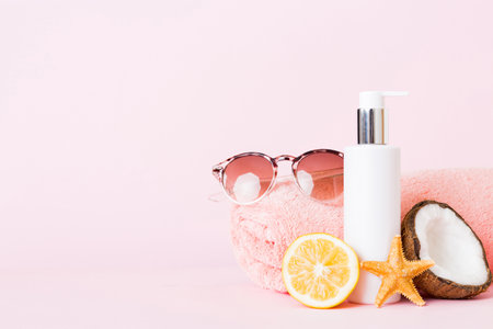 dispenser bottle and Citrus fruit in skincare product. beauty spa medical skincare and cosmetic lotion bottle cream product on table decor background with summer accessories.の写真素材