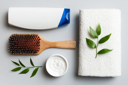 cosmetic for hair care, cream and towel on a colored background top view. flat lay.の写真素材