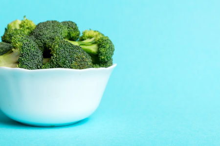 broccoli of fresh green broccoli in bowl over colored background. , close up. fresh vegetable.の写真素材