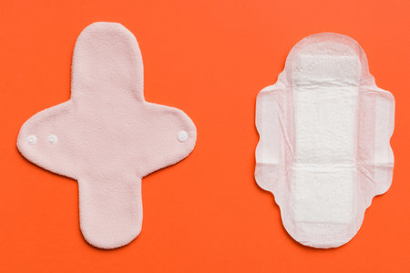 set of colorful bright reusable menstrual pads. zero waste woman periods concept top view with copy space.の写真素材