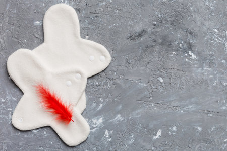 set of colorful bright reusable menstrual pads. zero waste woman periods concept top view with copy space.の写真素材