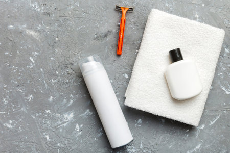 shaving man set. shaving machine, towel, lotion and shaving foam on colored background. Men bath Accessories top view.の写真素材