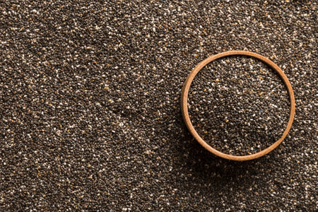 Space for text Texture of Chia seeds in wooden bowl, superfood concept. Top view.の写真素材