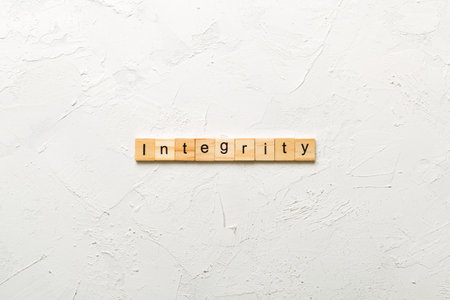 integrity written word on wood block. integrity text on table, concept.の写真素材