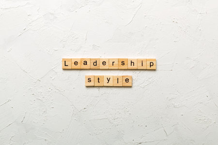 LEADERSHIP STYLE word written on wood block. LEADERSHIP STYLE text on cement table for your design,...