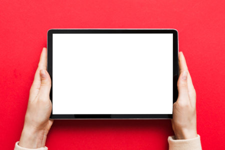 female teen hands using tablet pc with white screen, Mockup image of woman hand holding white tablet...
