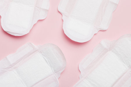 Women hygiene products or sanitary pad on colored background. Pastel color. Closeup. Empty place for text. Female daily hygiene.の写真素材