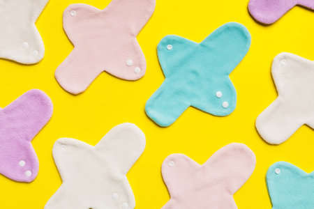 Eco-friendly reusable fabric women's pads. set of colorful bright reusable menstrual pads. zero waste woman periods concept top view with copy space.の写真素材