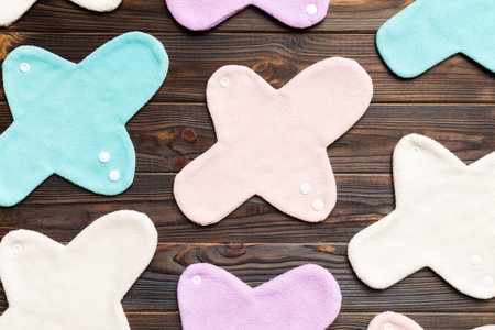 Eco-friendly reusable fabric women's pads. set of colorful bright reusable menstrual pads. zero waste woman periods concept top view with copy space.の写真素材