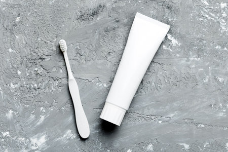 toothpaste and toothbrush top view with copy space on colored background. Flat lay. Dental hygiene....