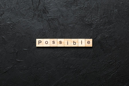 possible written word on wood block. possible text on table, concept.の写真素材