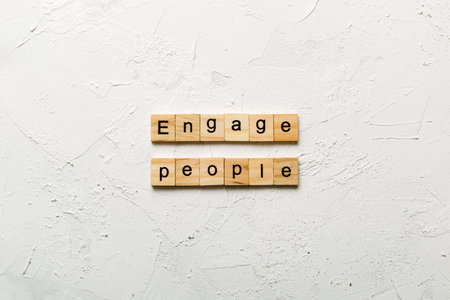 ENGAGE PEOPLE word written on wood block. ENGAGE PEOPLE text for your design, concept.の写真素材
