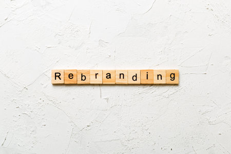 rebranding word written on wood block. rebranding text on table, concept.の写真素材