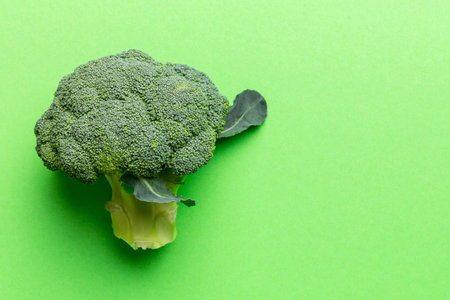 Top view fresh green broccoli vegetable on Colored background. Broccoli cabbage head Healthy or...
