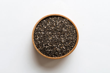 Chia seeds in bowl on colored background. Healthy Salvia hispanica in small bowl. Healthy superfood.の写真素材