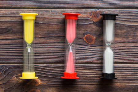 hourglass on the table, sand clock as time passing concept for business deadline, copy space.