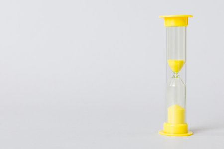 hourglass on the table, sand clock as time passing concept for business deadline, copy space.の写真素材