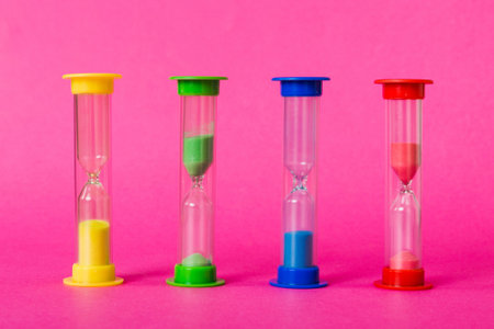 hourglass on the table, sand clock as time passing concept for business deadline, copy space.の写真素材