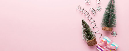 Flat lay composition with christmas trees on color background. Top view with copy space.の写真素材