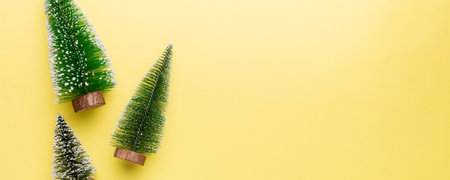 Flat lay composition with christmas trees on color background. Top view with copy space.の写真素材