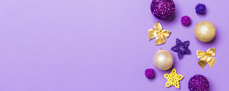 Top view of Christmas balls and creative decorations on colorful background with copy space. New Year concept.の写真素材