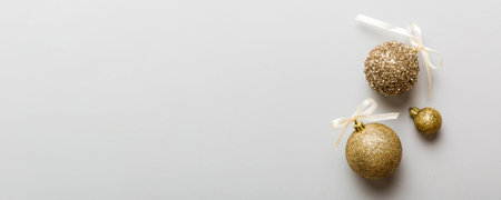 Christmas ball on colored background. decoration bauble with ribbon bow with copy space.の写真素材