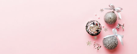 Christmas ball on colored background. decoration bauble with ribbon bow with copy space.の写真素材