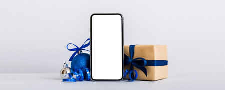 Digital phone mock up with rustic Christmas decorations for app presentation with empty space for...
