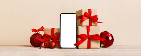 Digital phone mock up with rustic Christmas decorations for app presentation with empty space for...