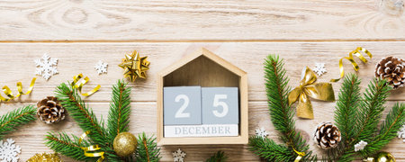 Christmas calendar 25 December. Christmas gift, fir branches, pine cones. Flat lay, top view. New...