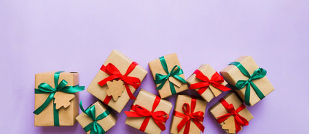 wrapped christmas or other holiday handmade present in paper with colored ribbon. Present box,...
