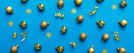 Christmas composition. a pattern of christmas balls on colored background. Flat lay, top view New year decor.の写真素材