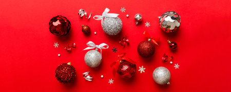 Christmas ball on colored background. decoration bauble with ribbon bow with copy space.の写真素材