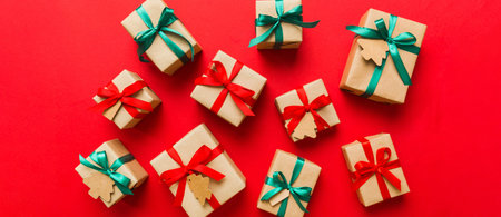 Colored craft gift boxes with colorful ribbons on colored background. Collection of Christmas...