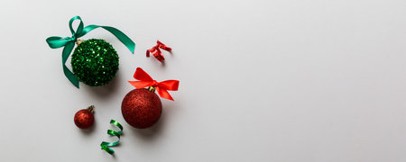 Christmas ball on colored background. decoration bauble with ribbon bow with copy space.の写真素材