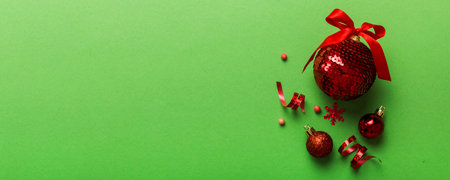 Christmas ball on colored background. decoration bauble with ribbon bow with copy space.の写真素材