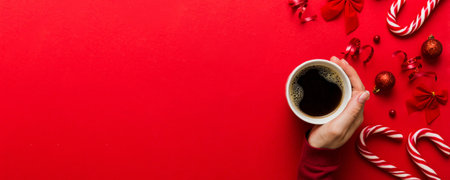Woman holding cup of coffee. Woman hands holding a mug with hot coffee. Winter and Christmas time concept.の写真素材