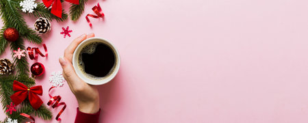 Woman holding cup of coffee. Woman hands holding a mug with hot coffee. Winter and Christmas time concept.の写真素材