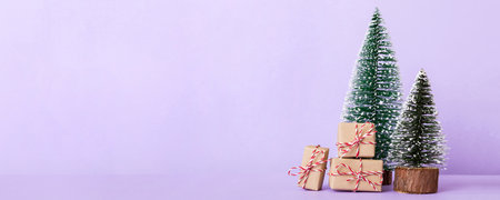 Christmas composition. Gifts, small tree, branches and craft DIY decorations on white background. New year concept. Christmas home decoration Flat lay, top view, copy space.の写真素材