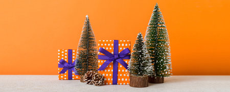 Christmas composition. craft Gift box, small tree, branches and craft DIY decorations on white background. New year concept. Christmas home decoration Flat lay, top view, copy space.の写真素材